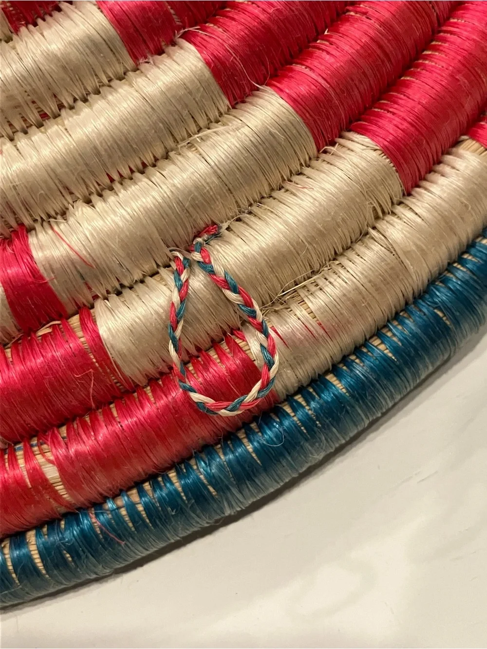 Vintage Handwoven Decorative Wall Basket in Teal, Red, and Cream
